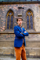 man in beige pants and a blue blazer