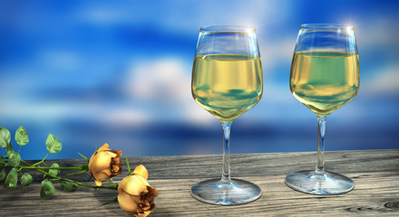 Two wine glasses filled with white wine with two yellow roses in daylight