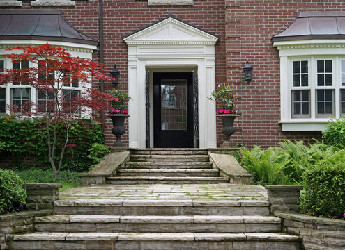 house front door with flagstone steps