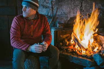 Mountaineer in shelter before the fire