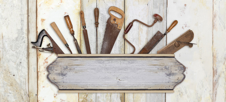 signboard and carpenter tools on wooden background