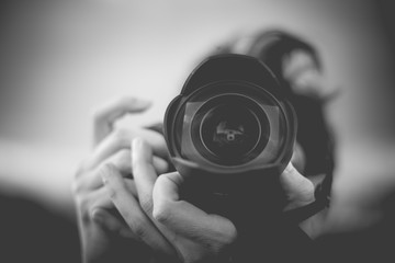 Black and White Photographer Man with a Fisheye Lens. Very Shallow Deep of Field. Vignette Applied....