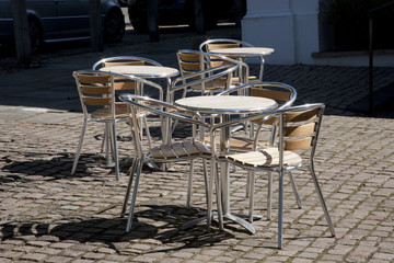 Cafe Tables and Chairs in Bright Sunshine