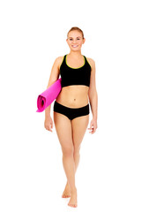 Fototapeta premium Woman ready for workout with yoga mats 
