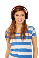Teenage woman listening to music