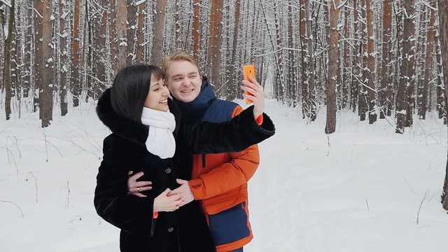 Happy couple taking selfie in slowmotion