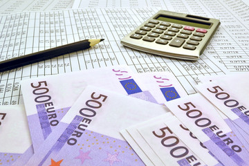 Image the euro money with calculator and financial tables with numbers
