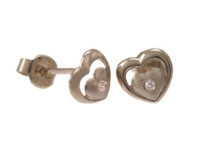 Obraz premium Pair of heart shaped gold earrings isolated on white