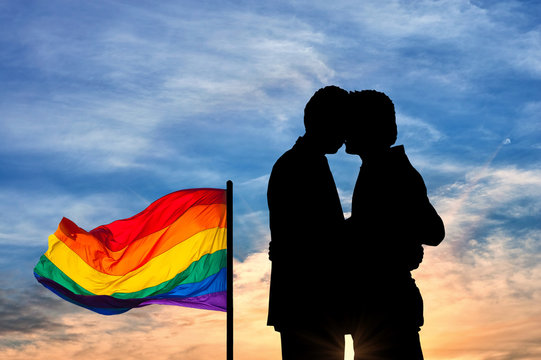 Silhouette happy gay kissing
