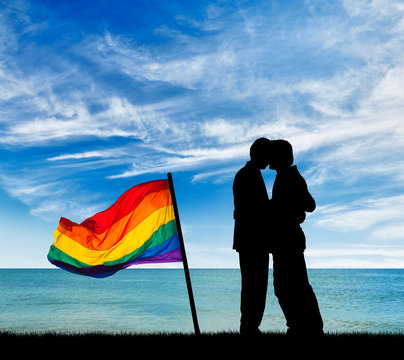 Silhouette happy gay kiss