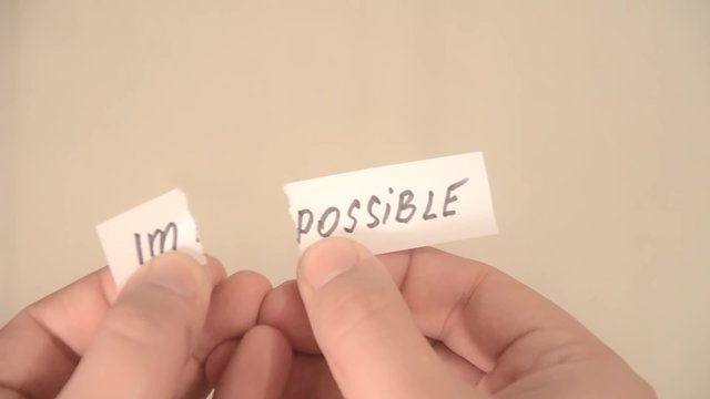 impossible turns to possible. Changing the word impossible to possible. Man makes the impossible possible