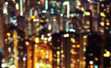 Fototapeta na wymiar blurred lights in windows of skycrapers, Hong Kong