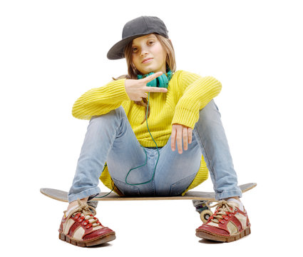  pretty young girl posing with a skateboard, sitting on skate, o