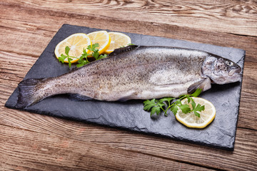 Fresh trout on a stone board