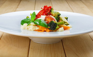 Traditional italian colored pasta with vegetables