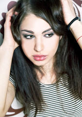 Fototapeta premium Portrait of a beautiful young woman in black and white with piercing eyes