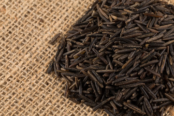 Heap of wild rice on white background