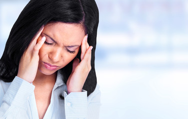 Woman having a migraine headache.