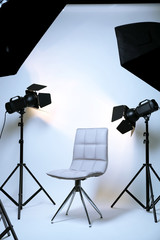 Photo studio with modern interior and lighting equipment