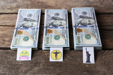 Packs of American dollars, on wooden background. Saving concept