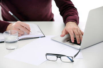 Businessman working with laptop in office