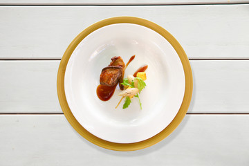 Duck dish on a white table