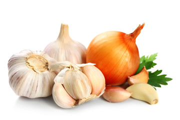 Garlic and onion with parsley leaves isolated on white