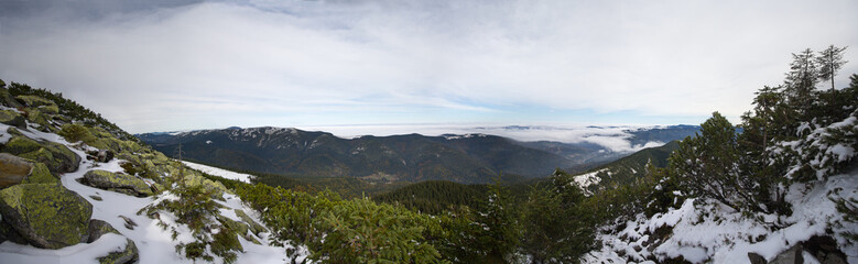 Panoramic view of the snow-capped mountains and Gorgan. Carpathi
