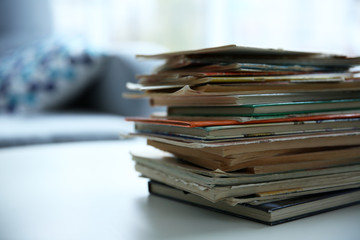 Pile of old books on white table