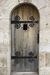 Beautiful old wooden door surrounded by an arch