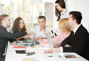 Young business people discussing a new project in a conference room