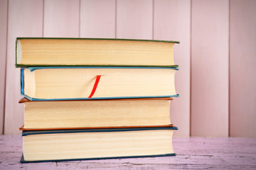 Pile of books on panel background