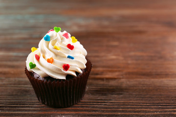 Cupcake on wooden background