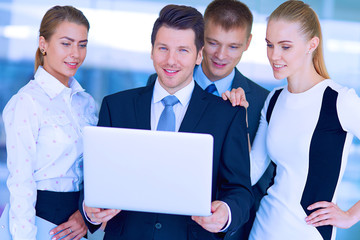 Group of  business people doing presentation with laptop during meeting