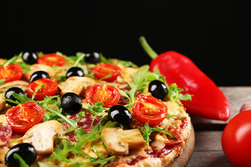 Delicious tasty pizza on black background