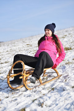 young woman with sled