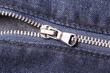 Blue jeans metal zipper closeup. © Paweł Michałowski