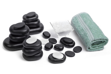 isolated massage stones set with salt and towels