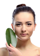 Portrait of beautiful woman with green leaf which isolated on white background, close up