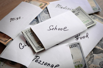 Rolls of money for needs on wooden background