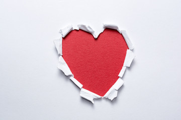 Naklejka na ściany i meble Heart shape handmade on white paper. Love and romance concept