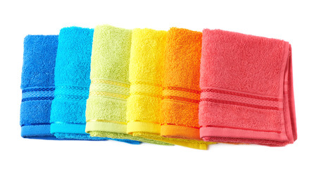 Pile of rainbow colored towels isolated