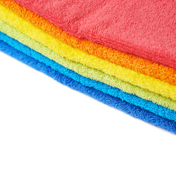 Rainbow colored pile of towels isolated