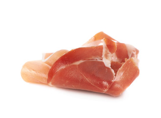 Folded prosciutto ham slice isolated