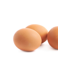Three brown eggs composition isolated