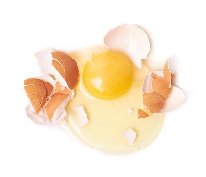 Cracked raw chicken egg isolated
