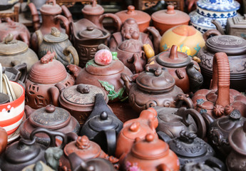 Fototapeta na wymiar purple clay teapot in collection market ,chengdu,china