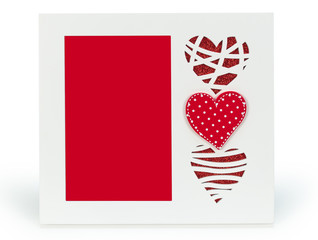 White photo frame with red hearts on isolaed  background 