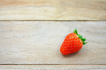 Fresh strawberries on wooden background