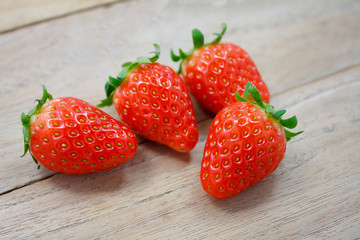 Fresh strawberries on wooden background